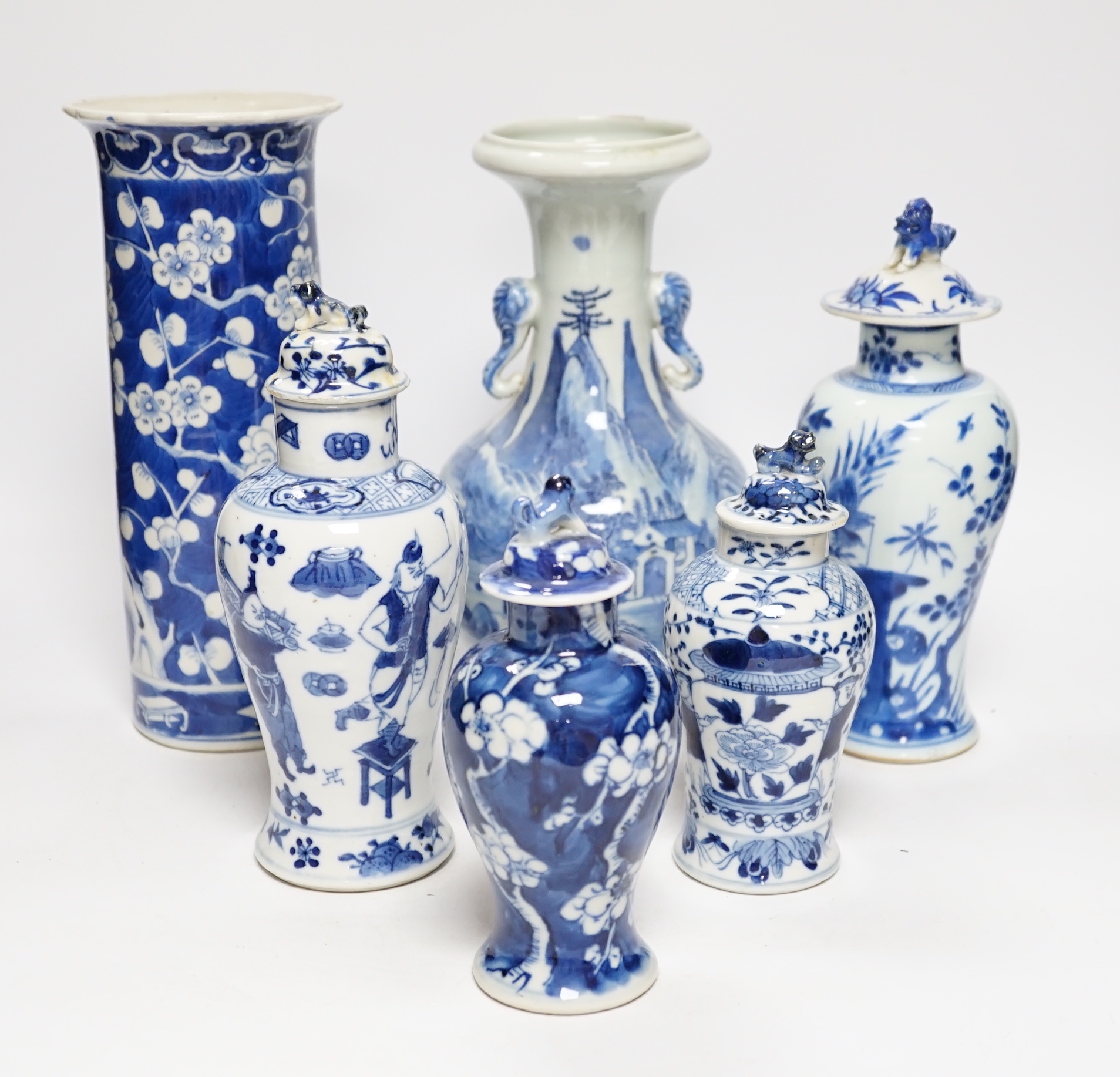 A late 19th century Chinese blue and white twin elephant head handle vase and five other 19th century Chinese blue and white vases, tallest 26cm